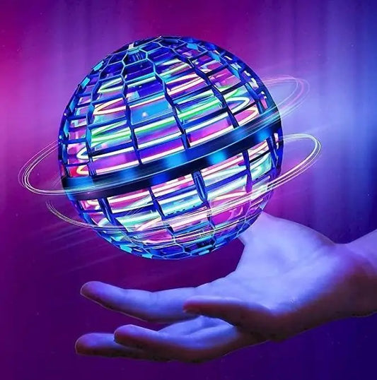 Colorful disco ball held in a hand against a purple background